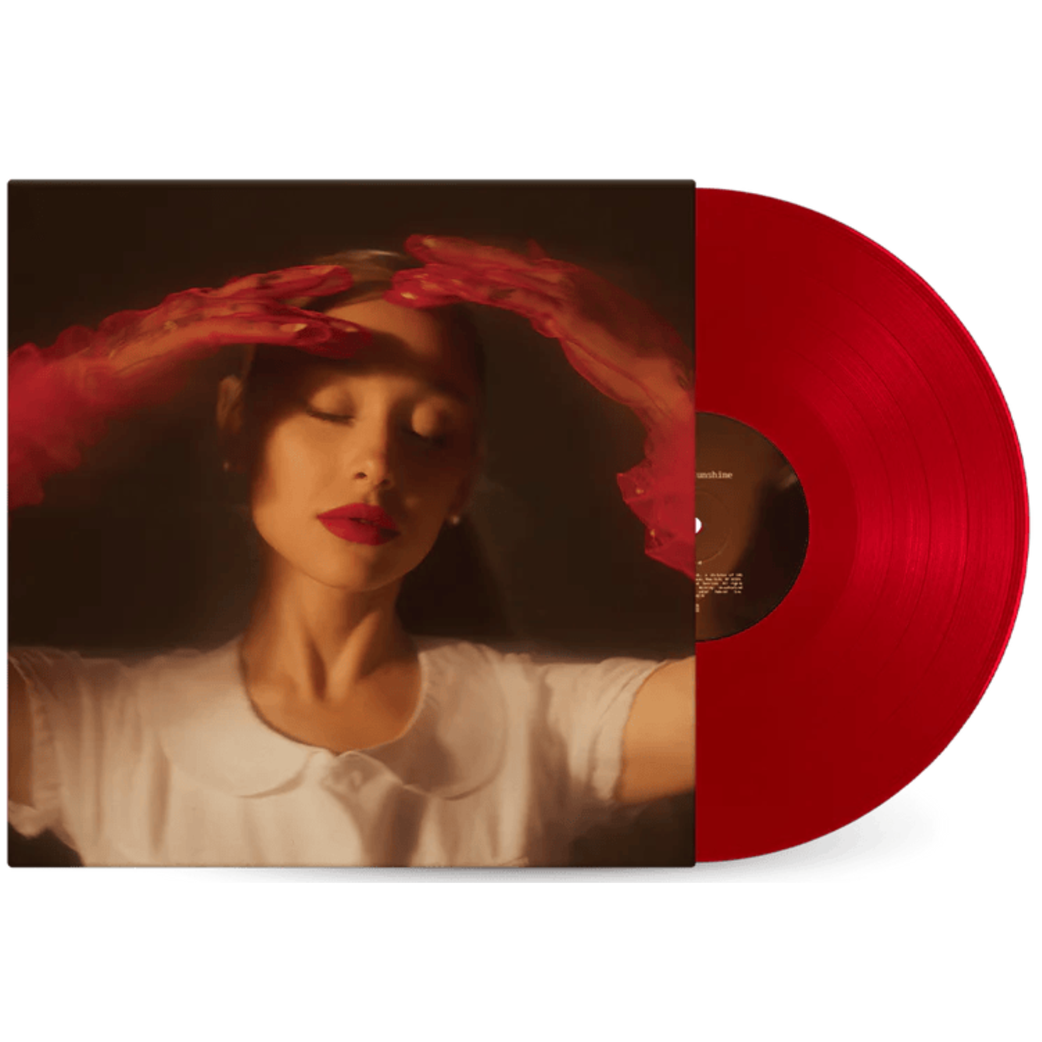 Red vinyl record with a person wearing a white shirt on the cover