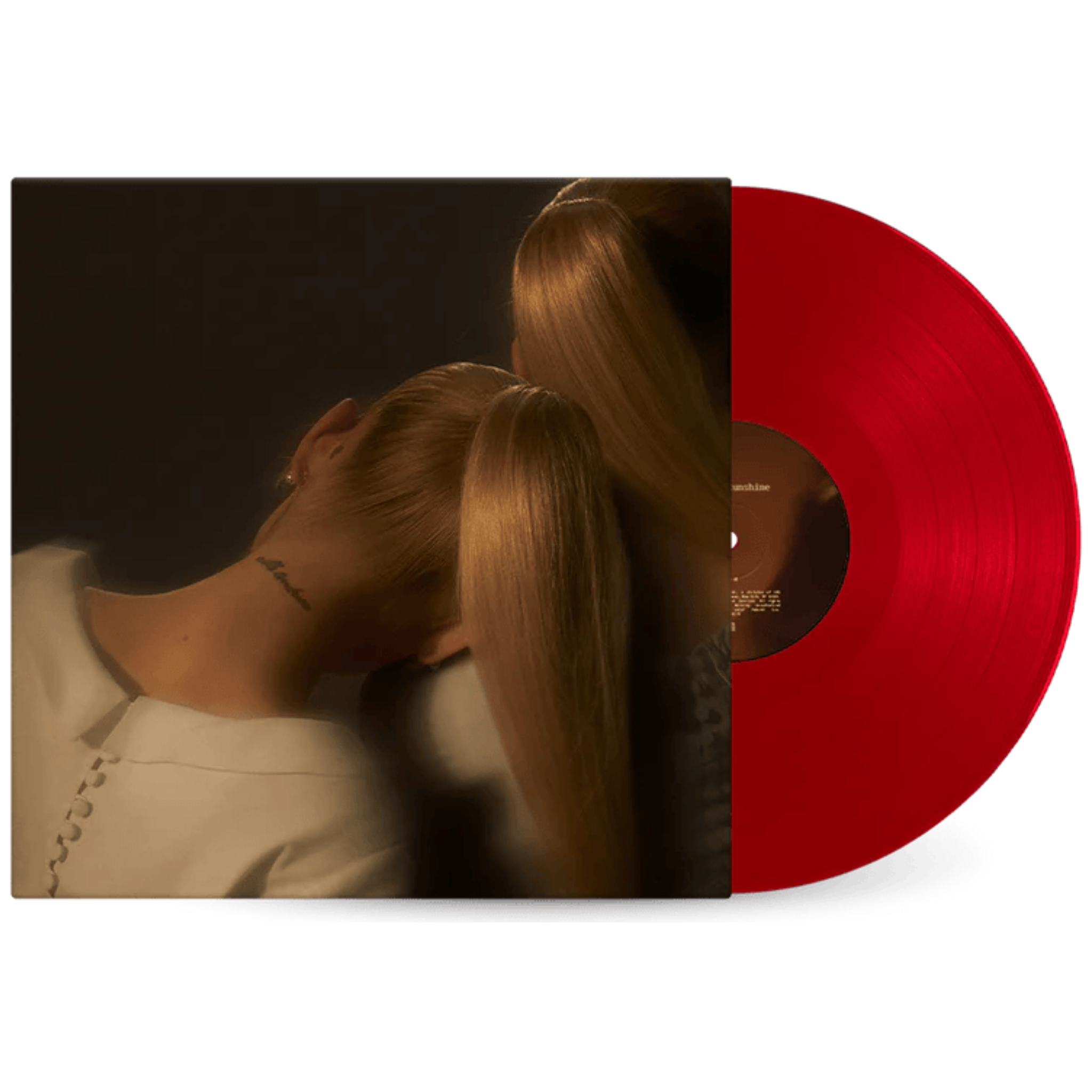 Vinyl record with a person with long hair and a dark background